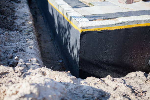 Professional Basement Waterproofing technician working in Albany, OR